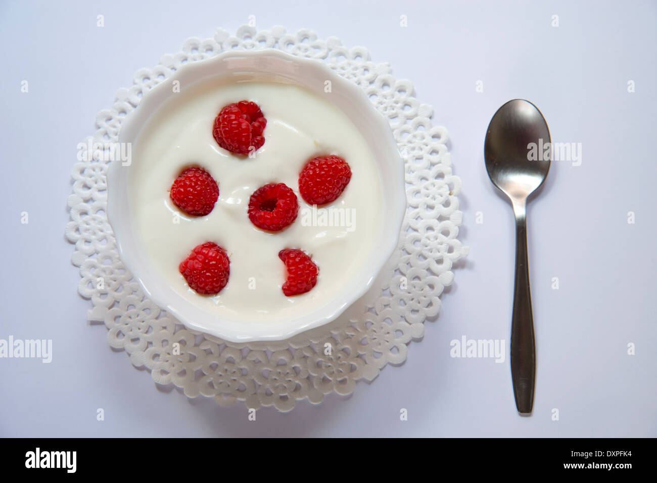 Cream with raspberries, view from above. Stock Photo