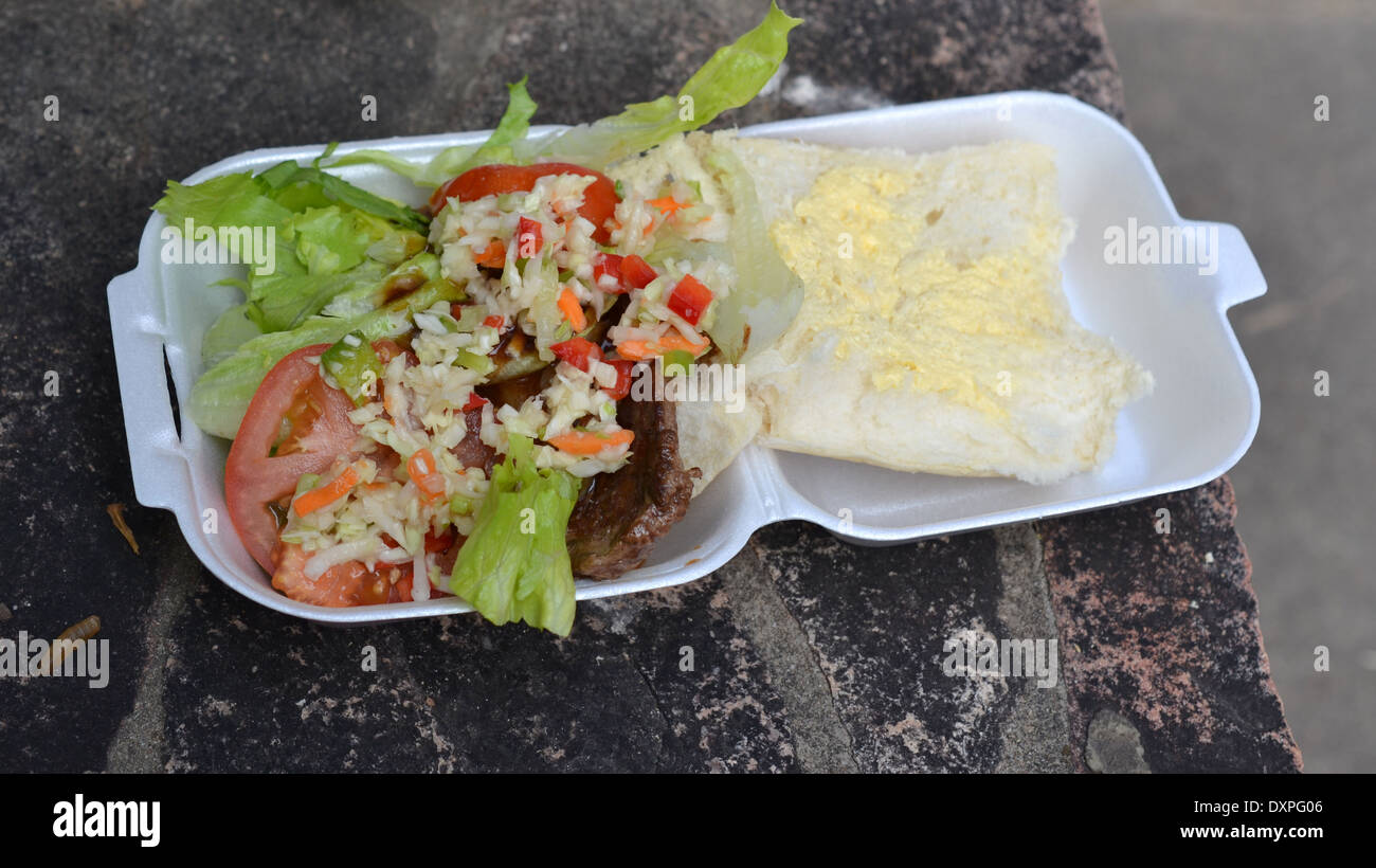 Steak sandwich with lettuce tomato and coleslaw Stock Photo Alamy