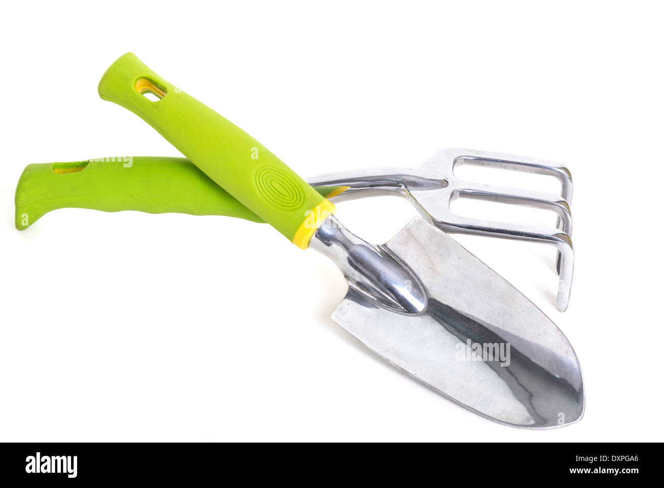 A garden trowel and rake on a white background Stock Photo - Alamy