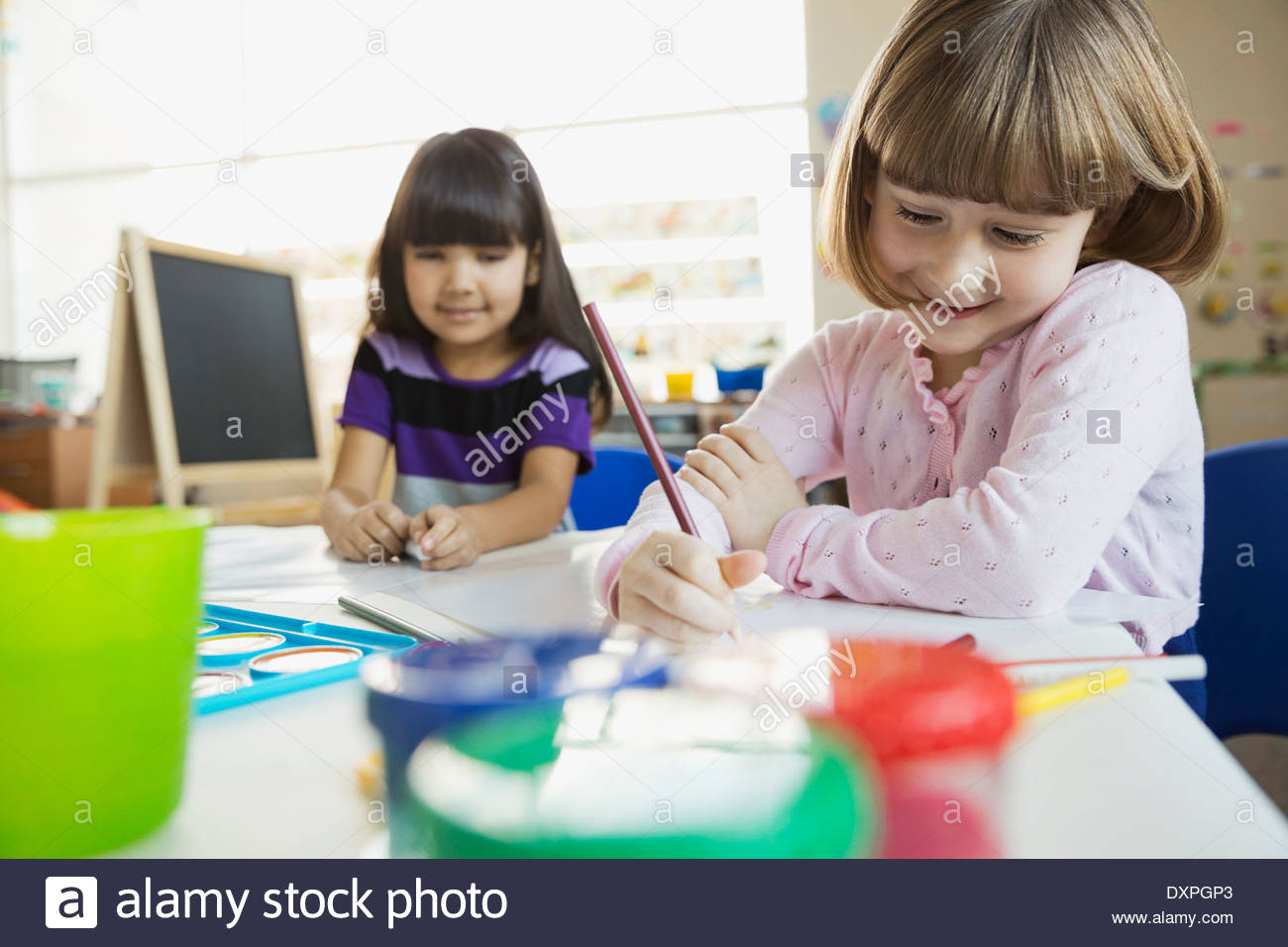 Girls drawing in art class Stock Photo