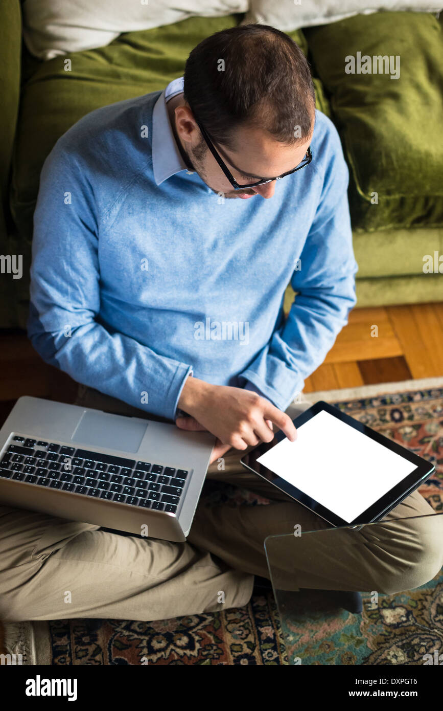 elegant business multitasking multimedia man using devices at home ...