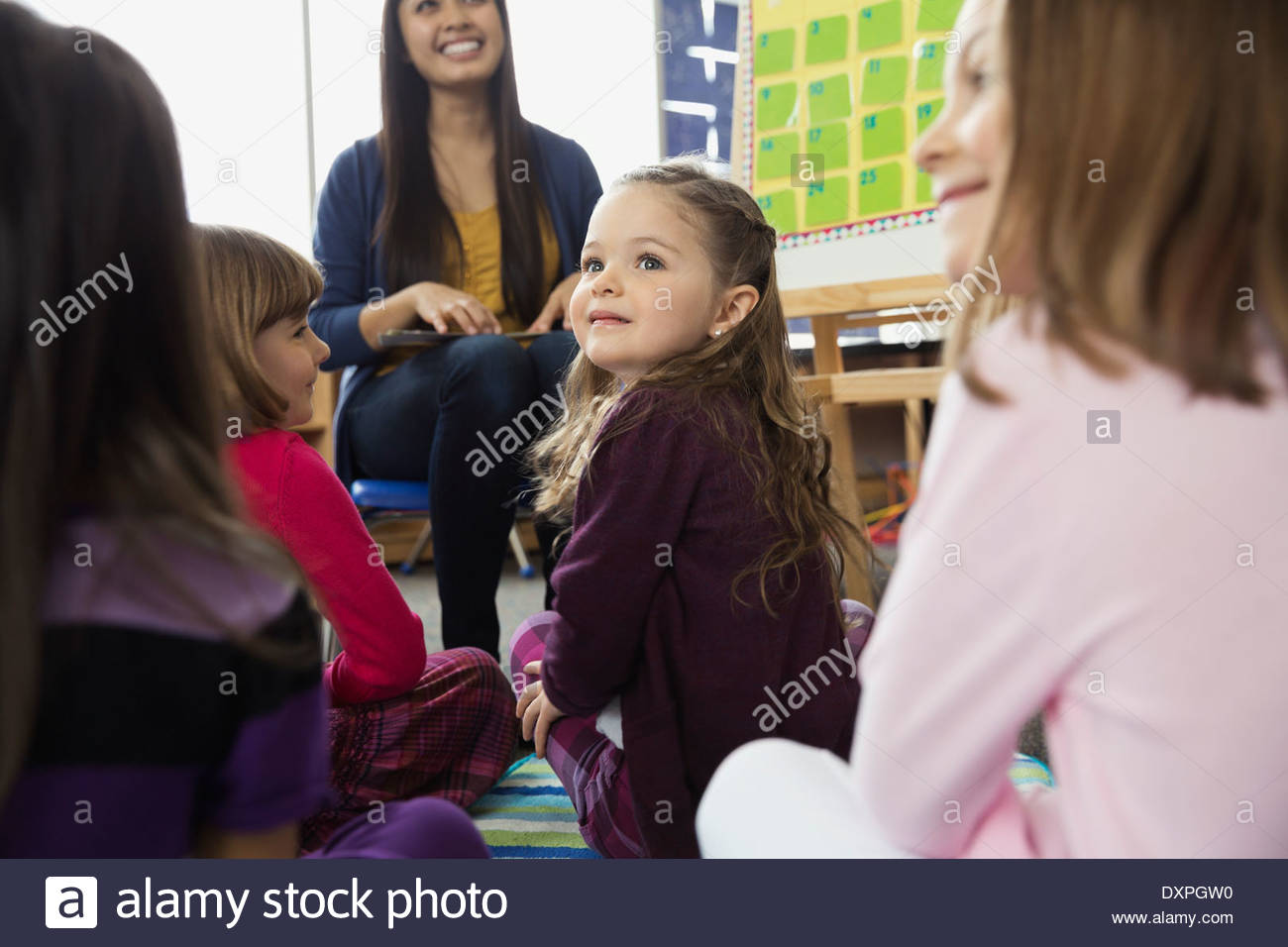 School girls sitting on floor hi-res stock photography and images - Alamy