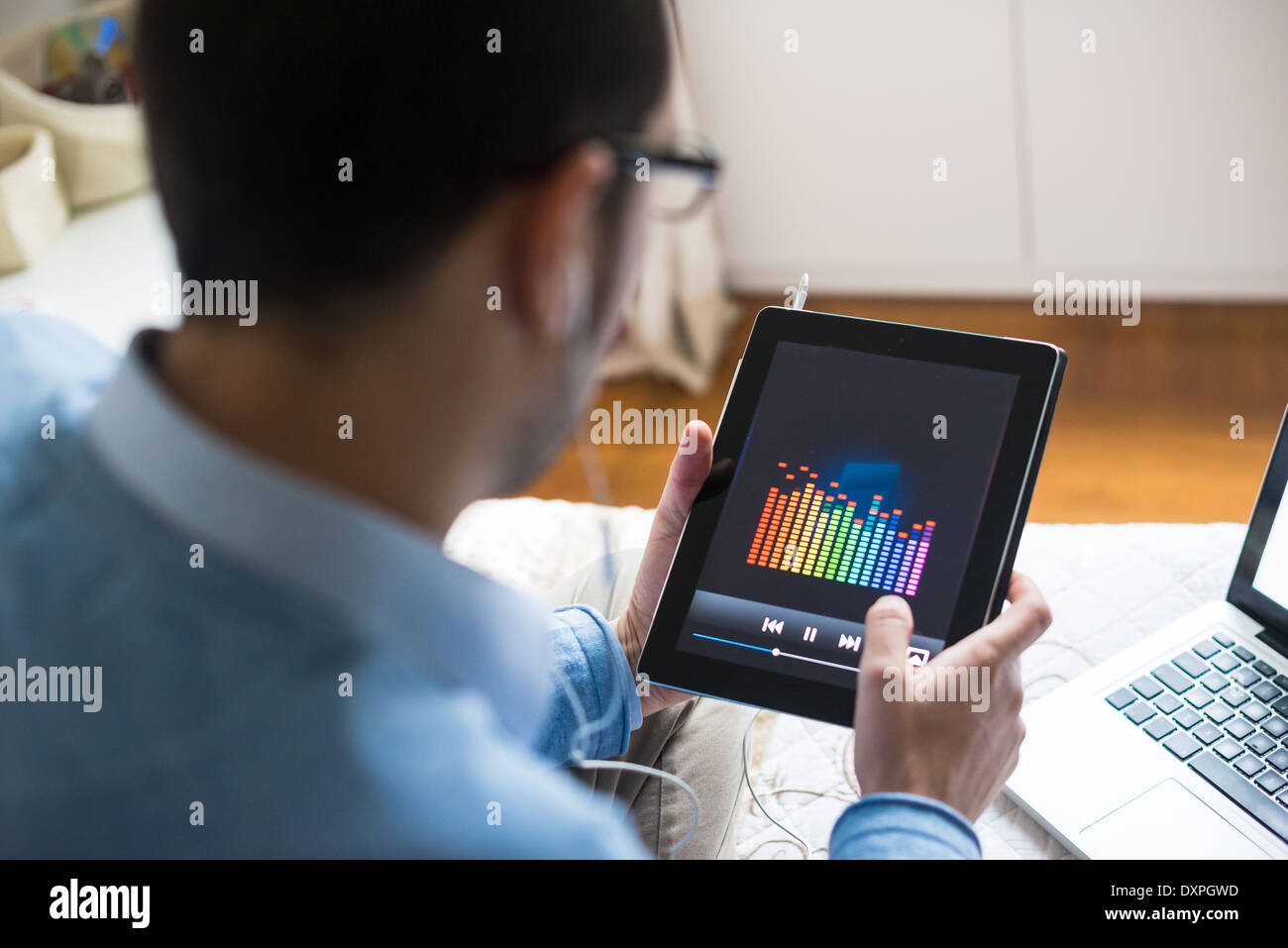 elegant business multitasking multimedia man using devices at home Stock Photo