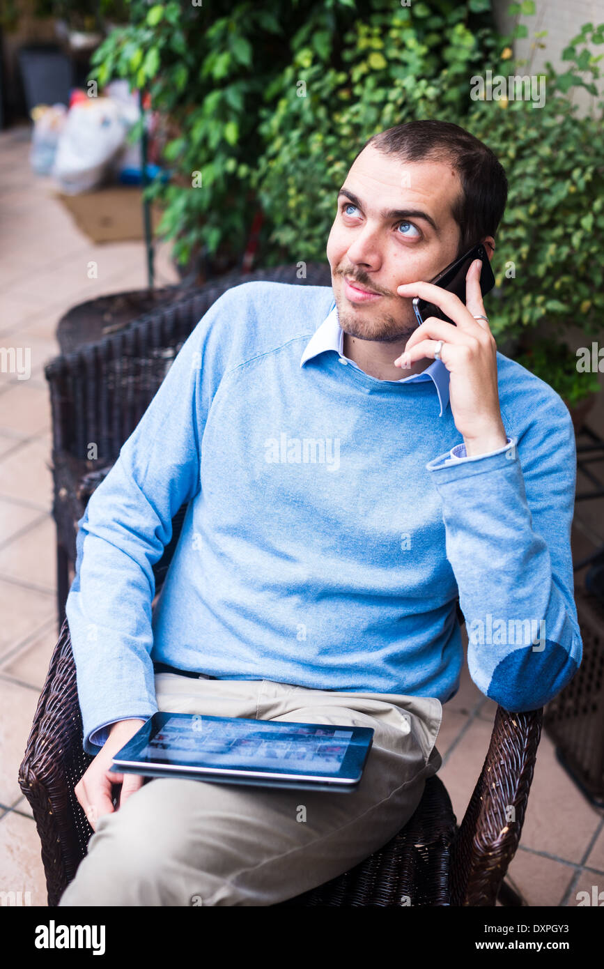 Man Using Devices Handheld wireless devices hi-res stock photography and images - Alamy