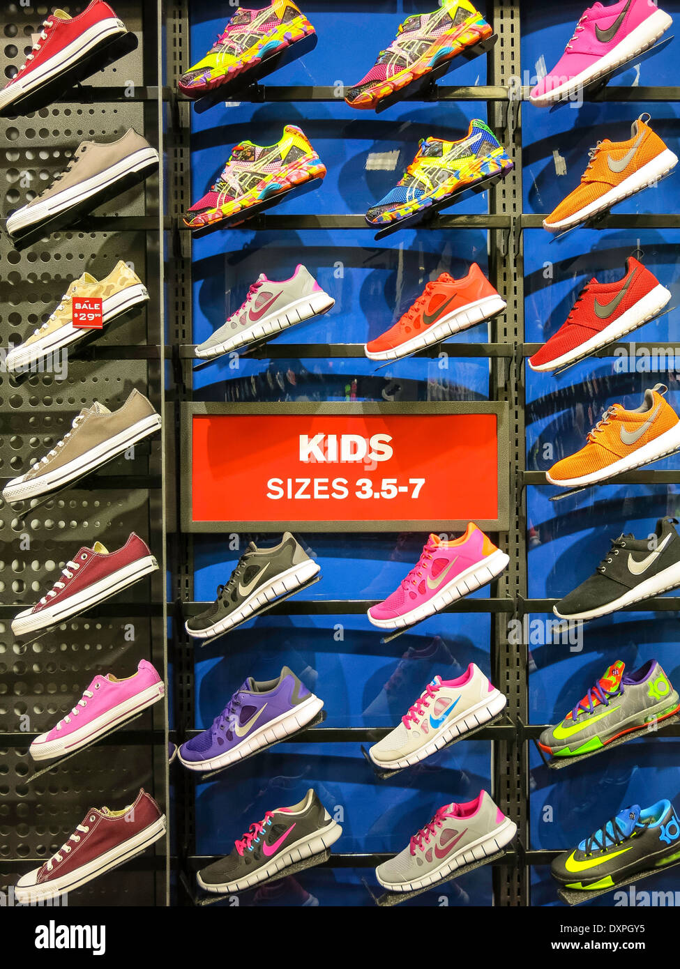 Nike Kids, sizes 3,5-7, Athletic Shoe Wall, Foot Locker Stock Photo ...