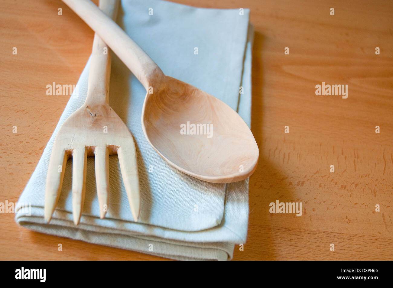 Wooden fork and spoon on napkin. Still life Stock Photo Alamy