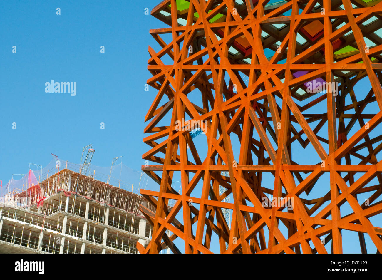 Modern sculpture and buildings under construction, close view. Plaza del Sol, Mostoles, Madrid province, Spain. Stock Photo