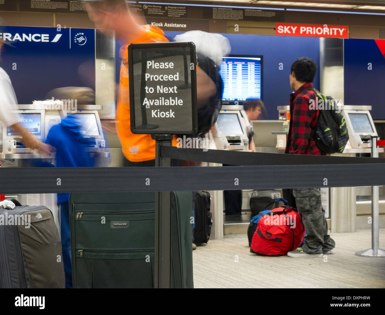 People Waiting in Line with Luggage at the Tampa International Airport