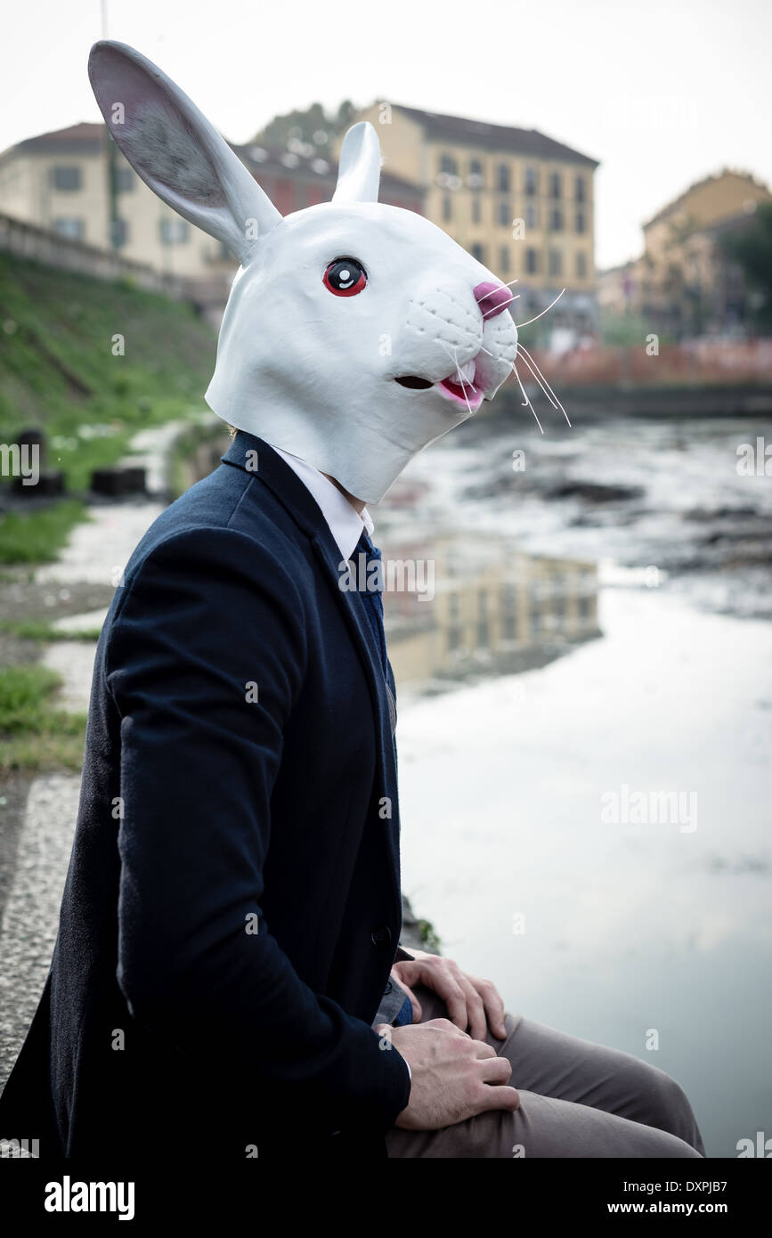 rabbit mask man in a desolate landscape river Stock Photo Alamy
