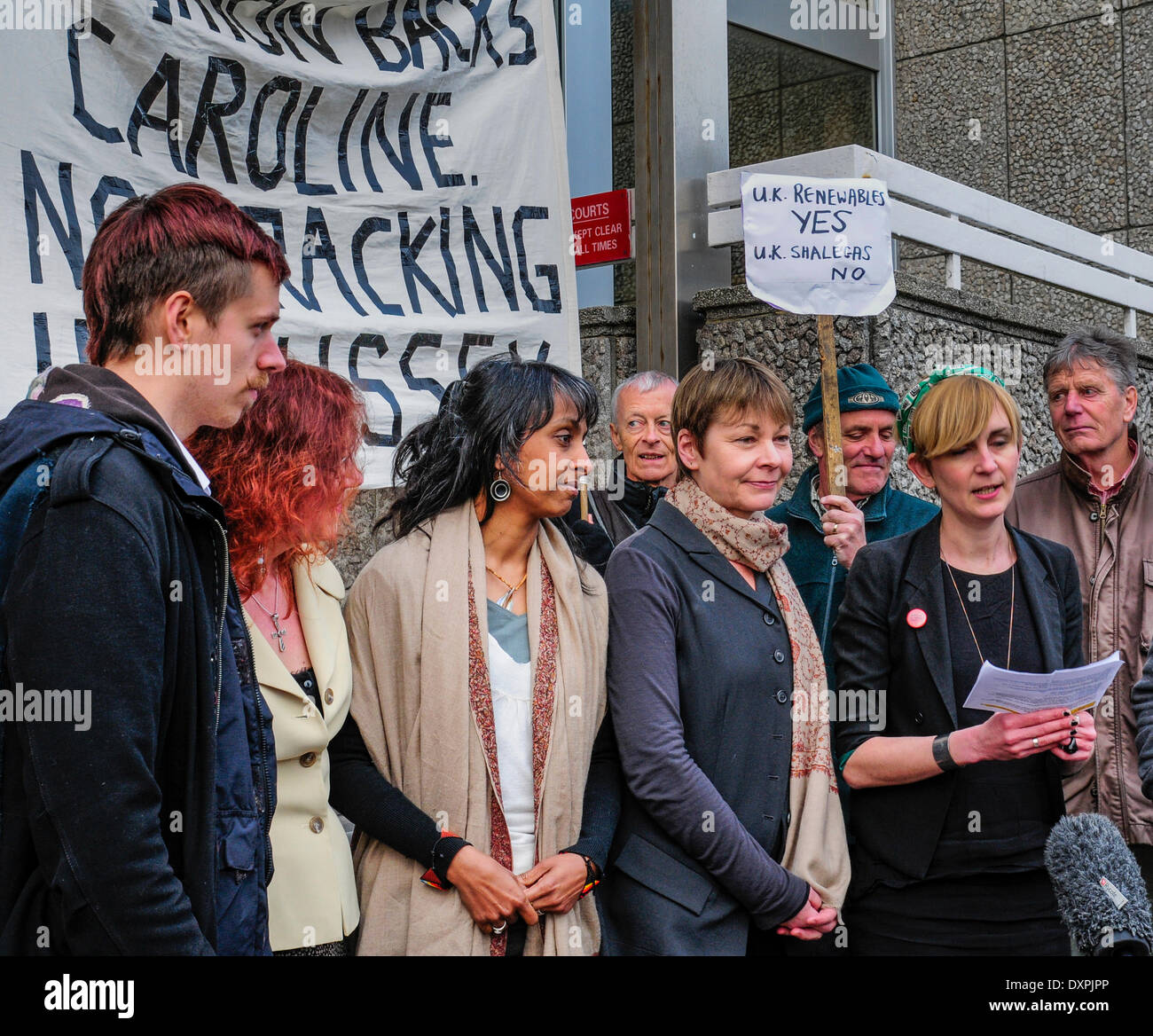 Brighton, East Sussex, UK..28 March  2014..Caroline Lucas MP outside Brighton Court  with co defendants after day 5 of their trial charged with obstructing the highway and a public order offence at Balcome where Cuadrilla was test drilling in August. The case has been adjourned to 17 April. Ms Lucas joined co defendants and supporters outside the court where Sheila Menon, also charged, read a statement  about Fracking and Ms Lucas thanked her supporters.. David Burr/Alamy Live News Stock Photo