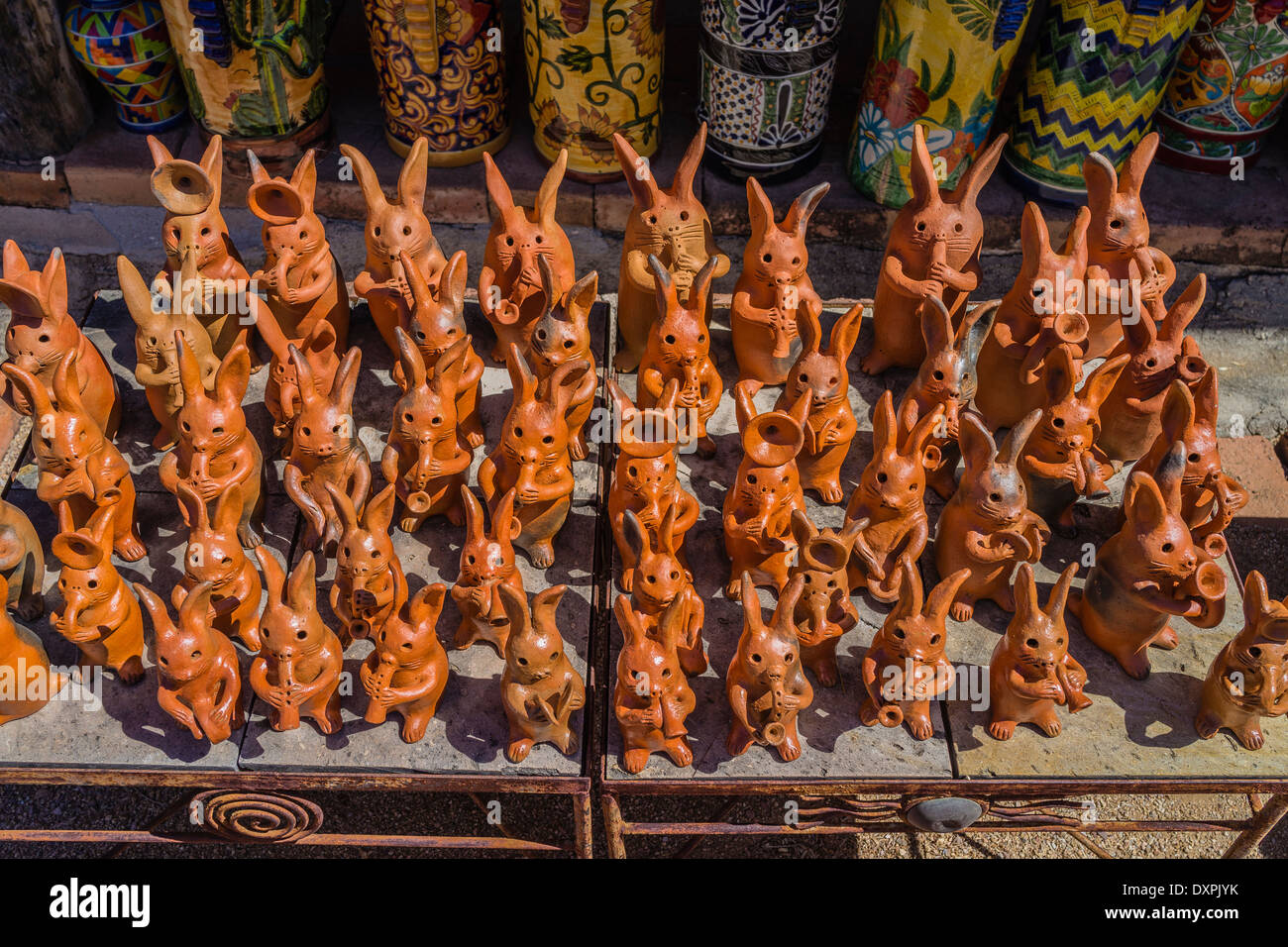 Terra cotta rabbits on display for sale at a pottery shop in Tuboc ...