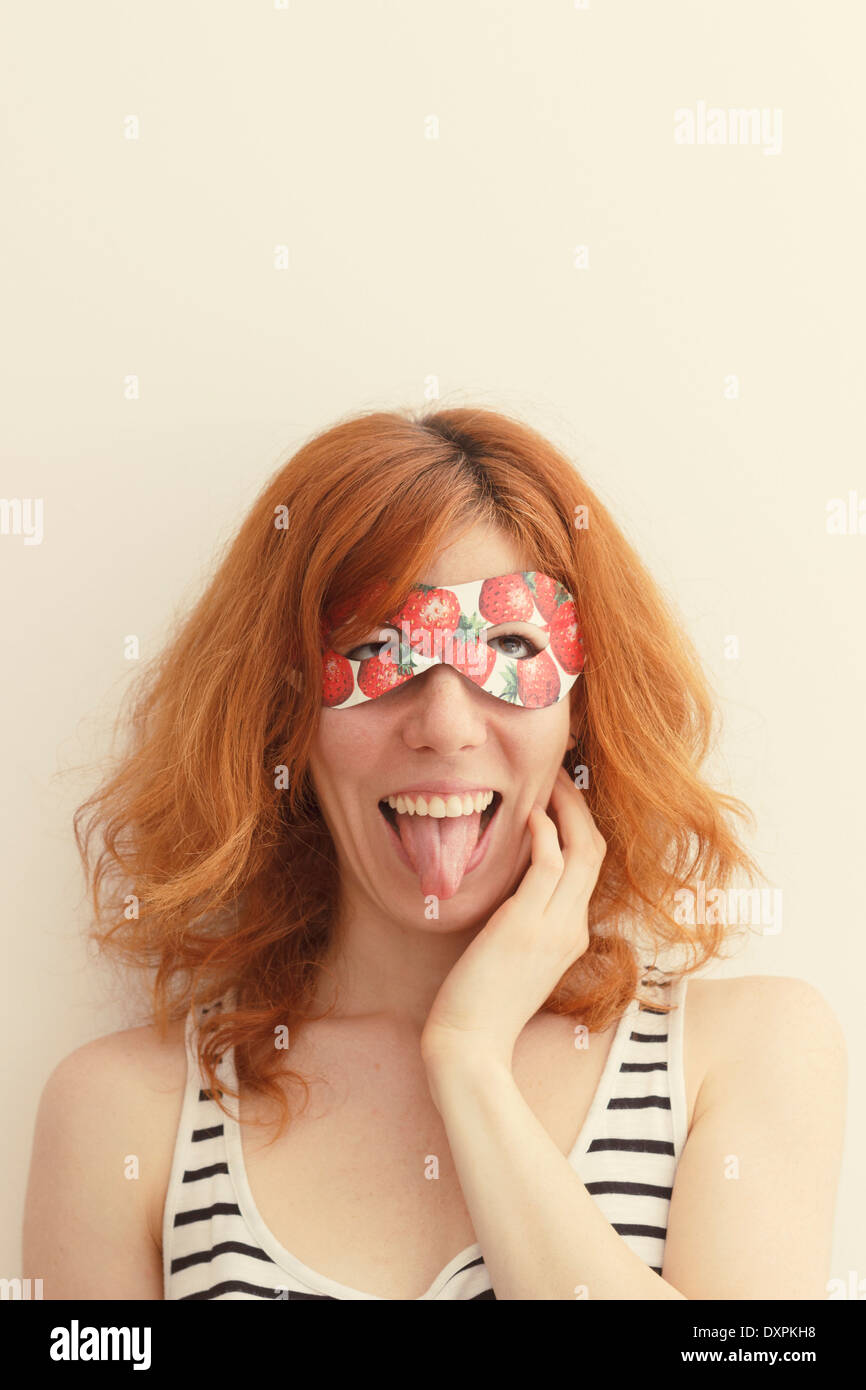 Superhero girl wearing mask with strawberries Stock Photo