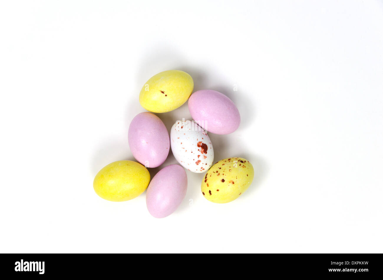 Multi coloured easter eggs confection at white background Stock Photo