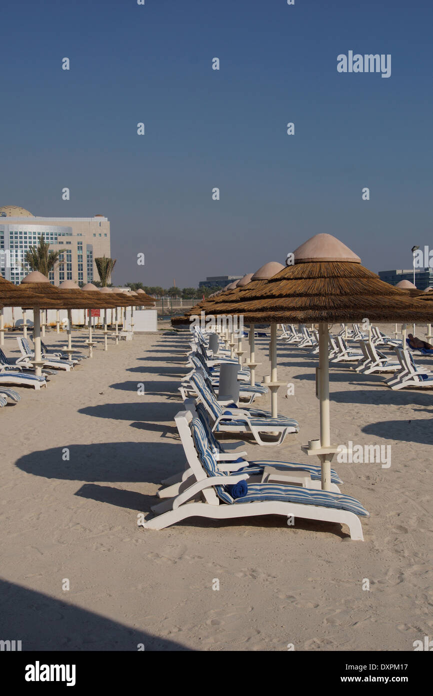 Sun loungers on the beach at the Intercontinental Hotel in Abu Dhabi Stock Photo