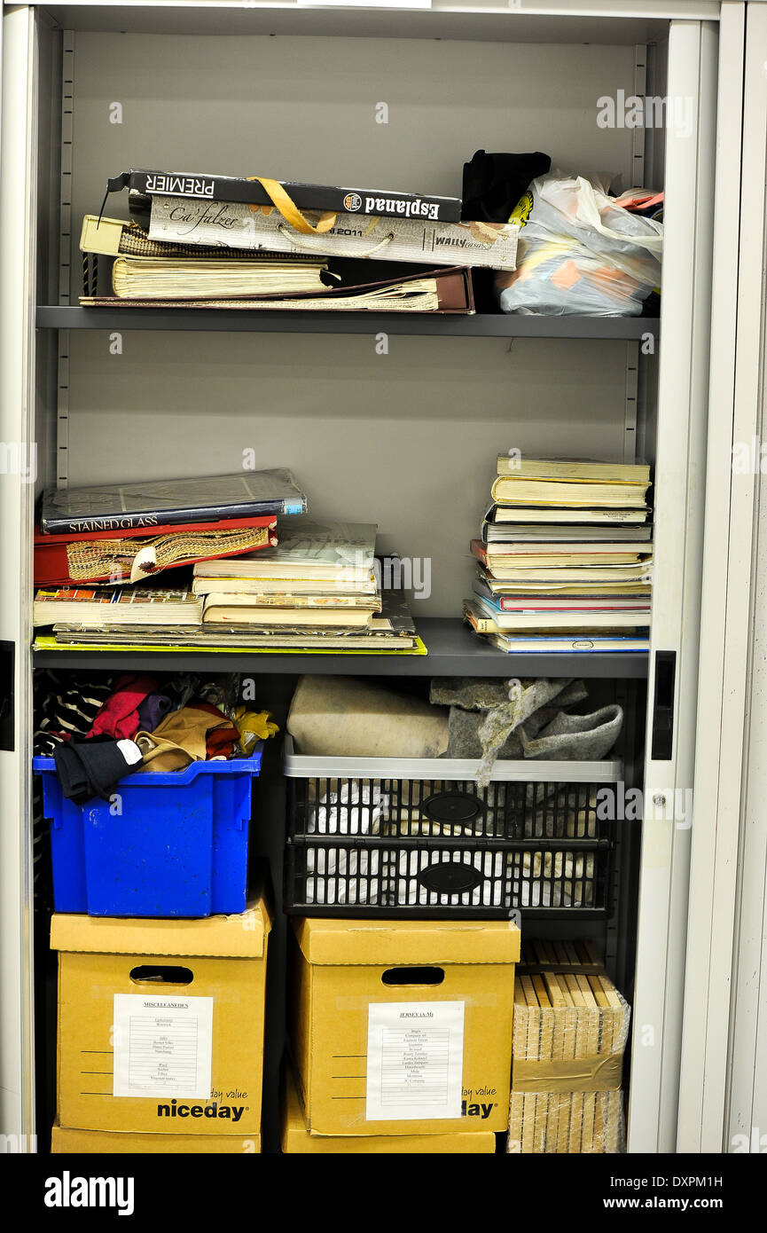 Books and boxes inside a cabinet Stock Photo - Alamy