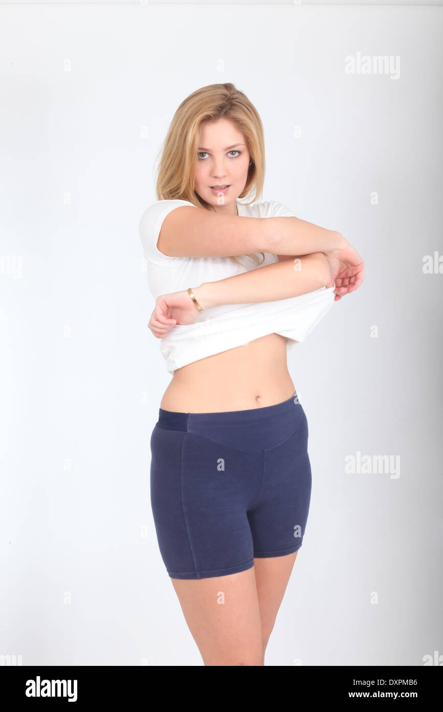Beautiful Blonde Teenage Model Undressing From Her Sports Shirt February 2014 Stock Image Beautiful Blonde Teenage Model Undressing From Her Sports Shirt February 2014 Stock Image