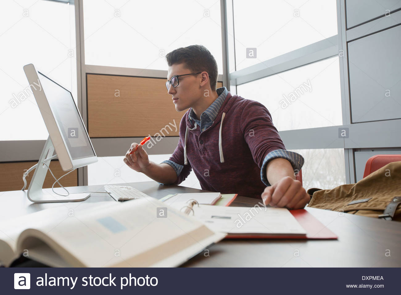 College student studying at computer Stock Photo