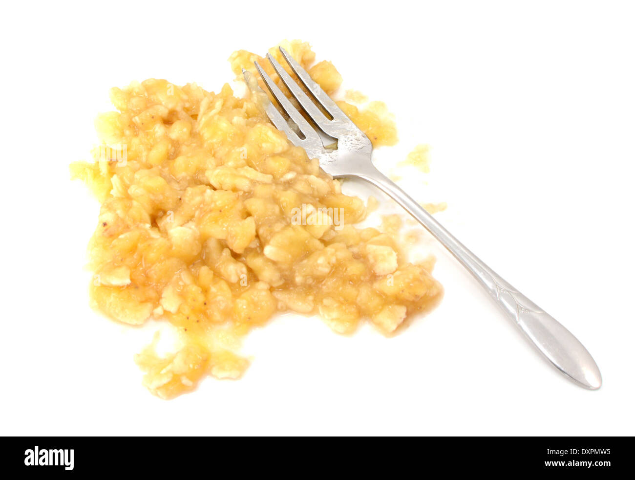 Mashed banana flesh with a fork, isolated on a white background Stock Photo