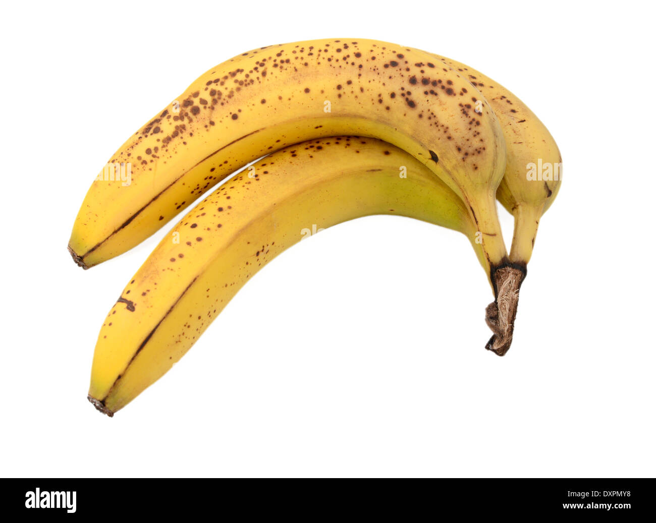 Three overripe bananas with brown spots, isolated on a white background Stock Photo