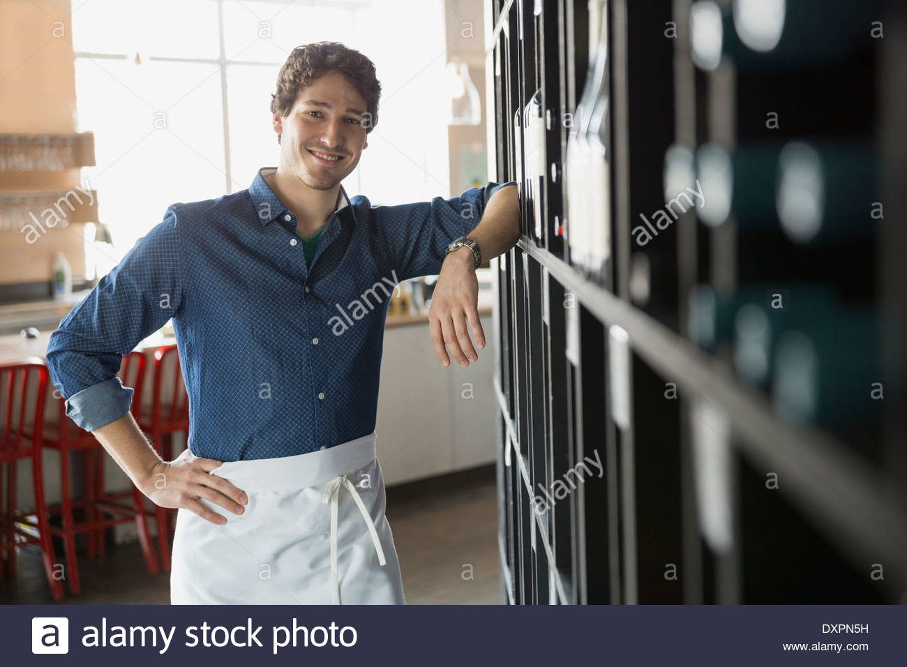Portrait of confident sommelier in wine store Stock Photo