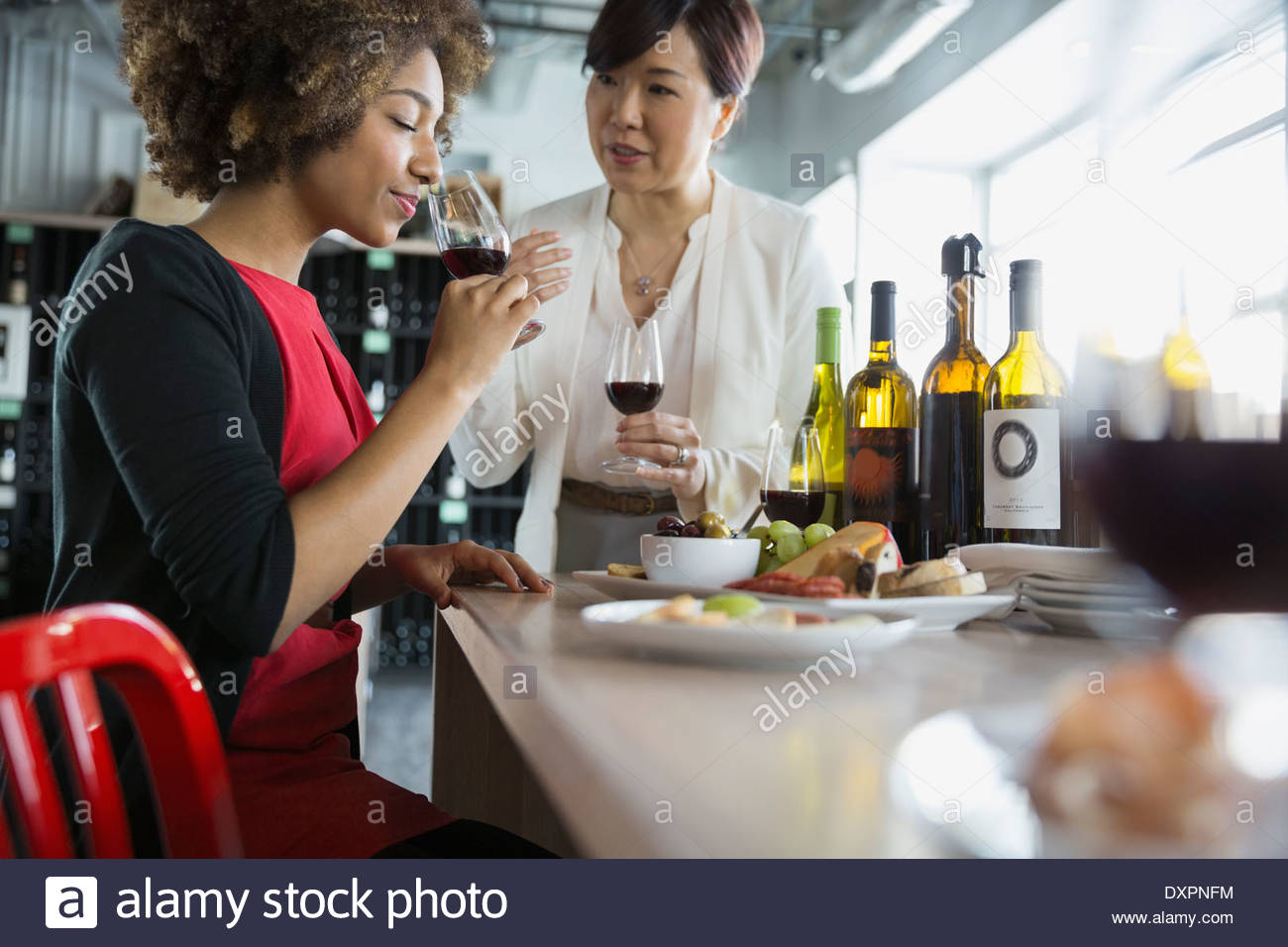Women wine tasting in store Stock Photo