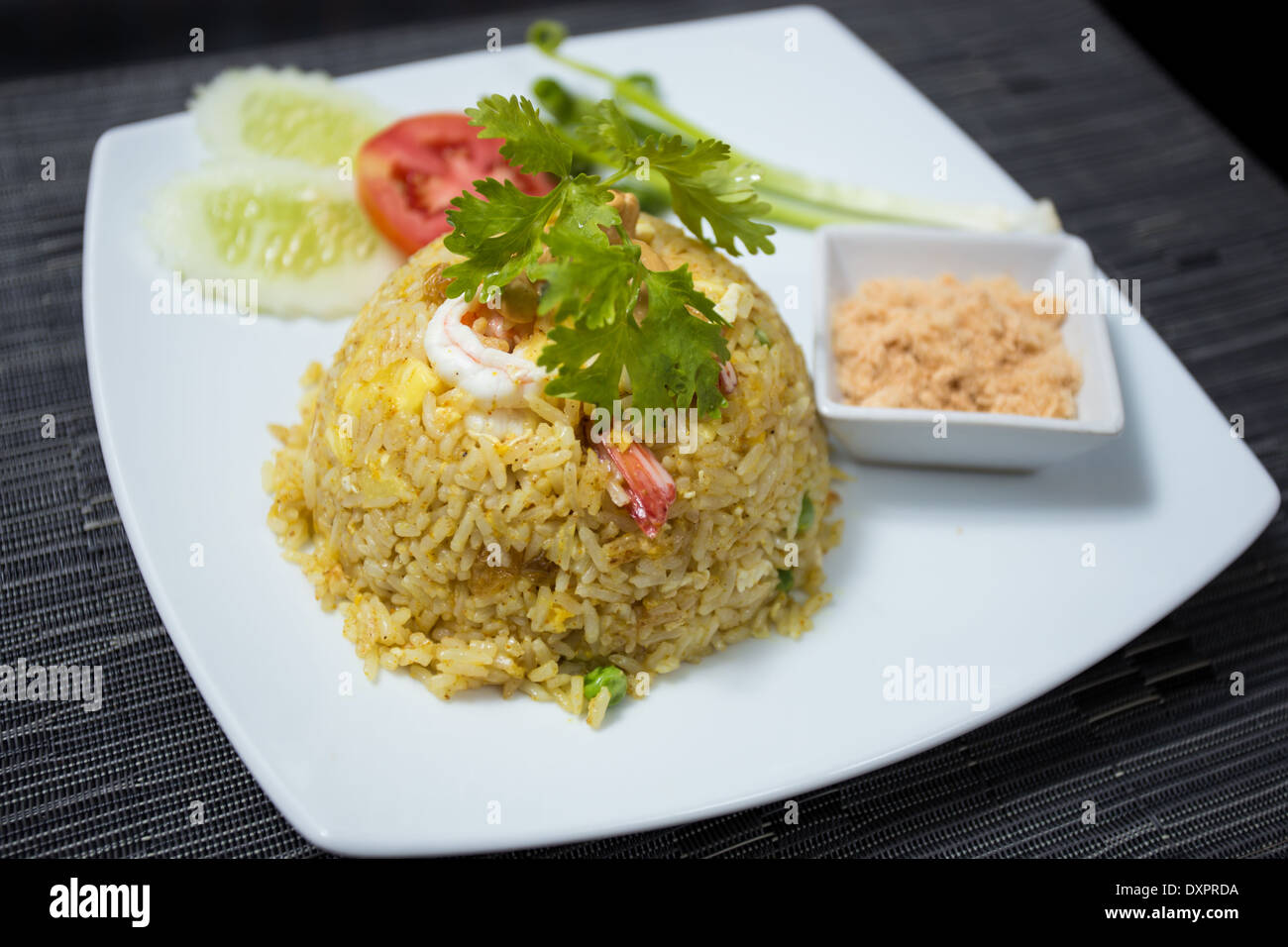 Baked rice with pineapple or Pineapple Fried Rice with Shrimp and dried shredded pork in white