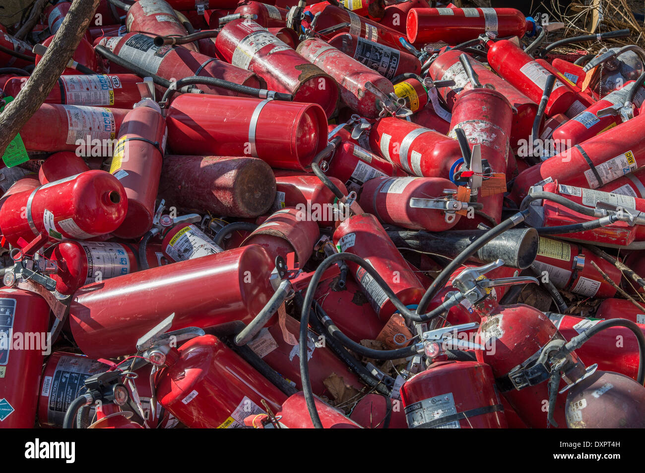 Pile Of Old Used Fire Extinguishers Stock Photo