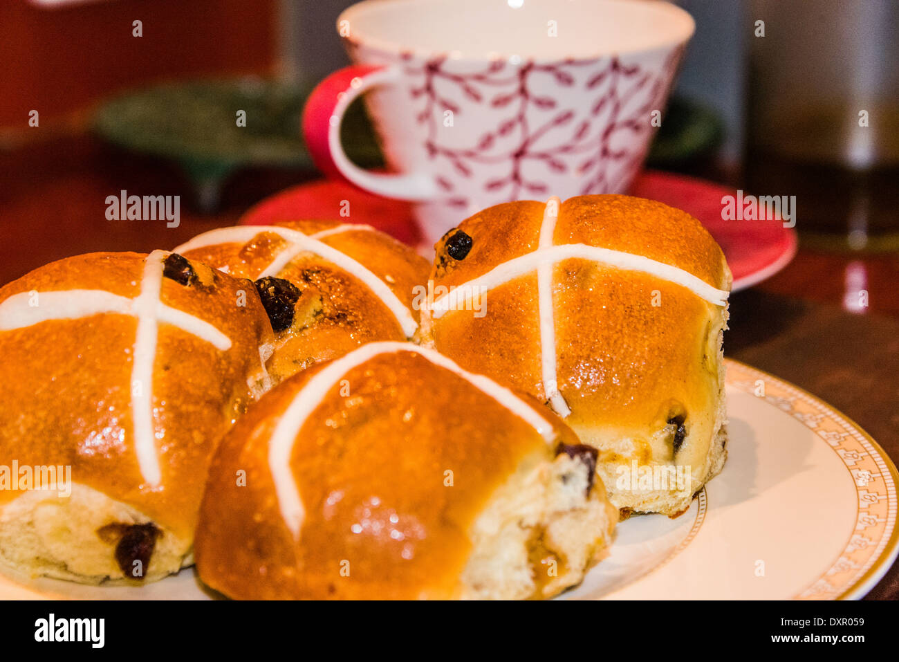 hot cross buns on plate for Easter afternoon tea Stock Photo