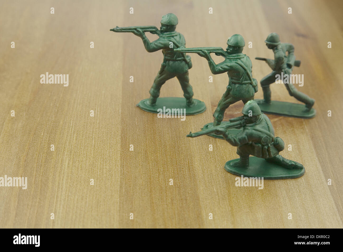 Close up shot of Plastic Toy Soldiers on a Wooden Table, Stock Photo