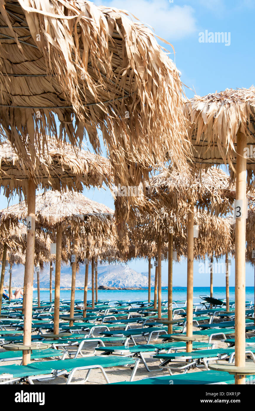 Umbrellas and sunbeds on Elafonissi beach, Crete, Greece Stock Photo
