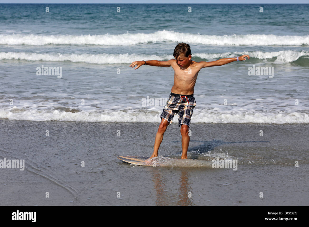 Cocoa Beach, Florida, He practices surfing at the beach Stock Photo
