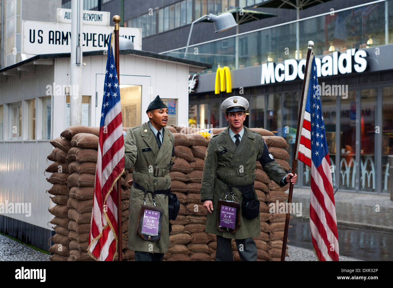 Berlin cold war Checkpoint Charlie Friedrichstrasse notorious border crossing American Soviet sectors east west wall. McDonald's Stock Photo