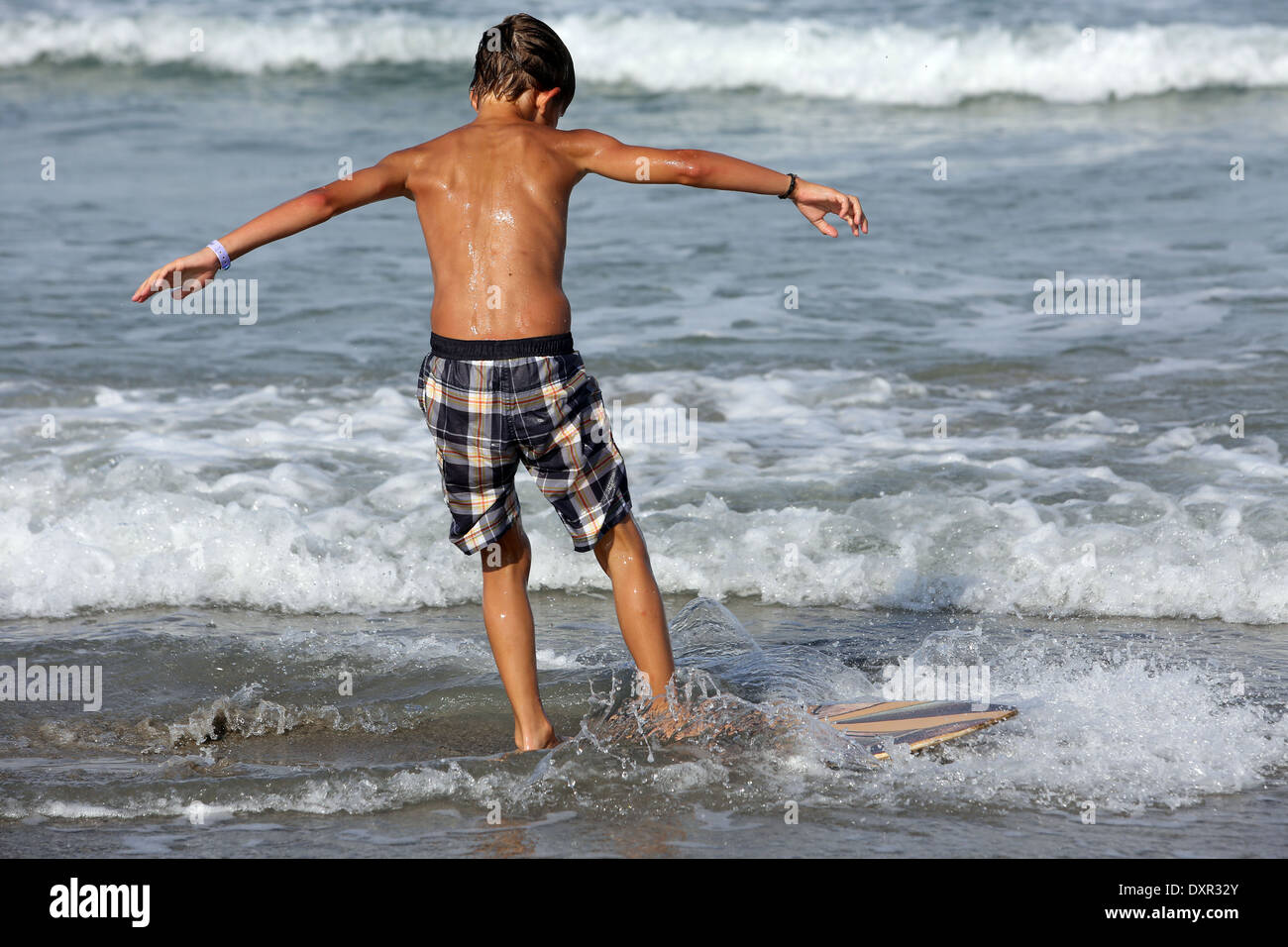 Cocoa Beach, Florida He practices surfing at the beach Stock Photo