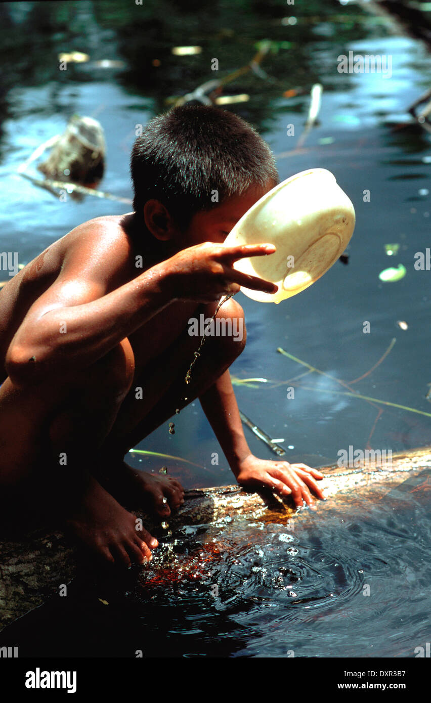 A Warao child drinking water in the Orinoco delta. The Warao are an indigenous people inhabiting northeastern Venezuela and west Stock Photo