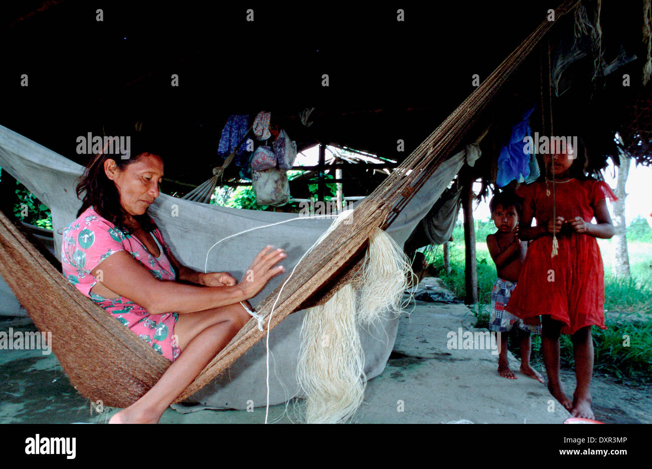 Woman doing a hammock in the Orinoco River. The Warao are an indigenous people inhabiting northeastern Venezuela and western Guy Stock Photo