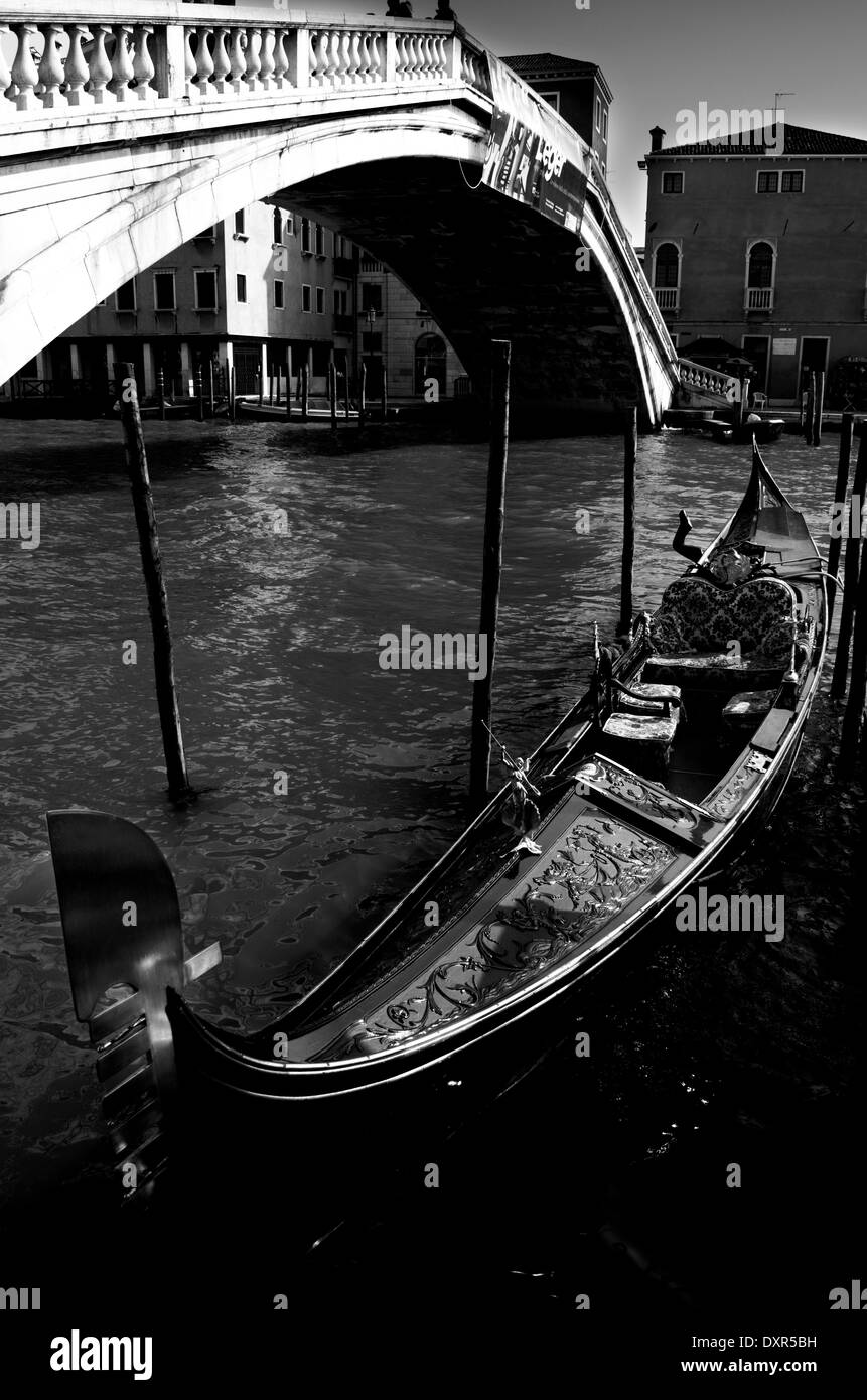 Gondola boat by Rialto bridge at Grand Channel in Venice Stock Photo