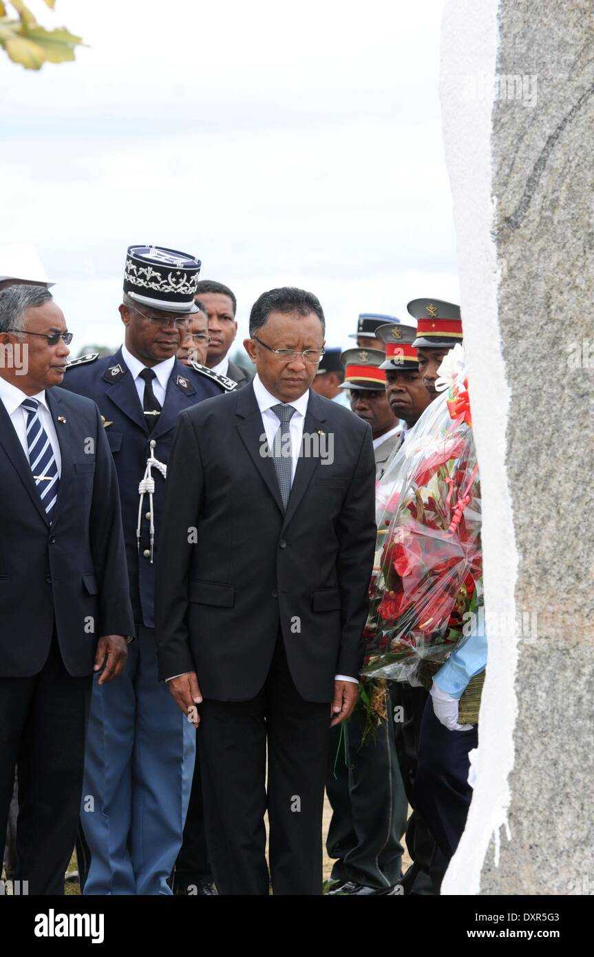 Moramanga. 29th Mar, 1947. Madagascar's president Hery Rajaonarimampianina (C) put wreath to the martyrs in Moramanga, 110 km northeast of capital Antananarivo on March 29, 2014. Madagascar commemorated on Saturday the date of March 29, 1947, which is historic for Malagasy people for their uprising against France. Credit:  He Xianfeng/Xinhua/Alamy Live News Stock Photo