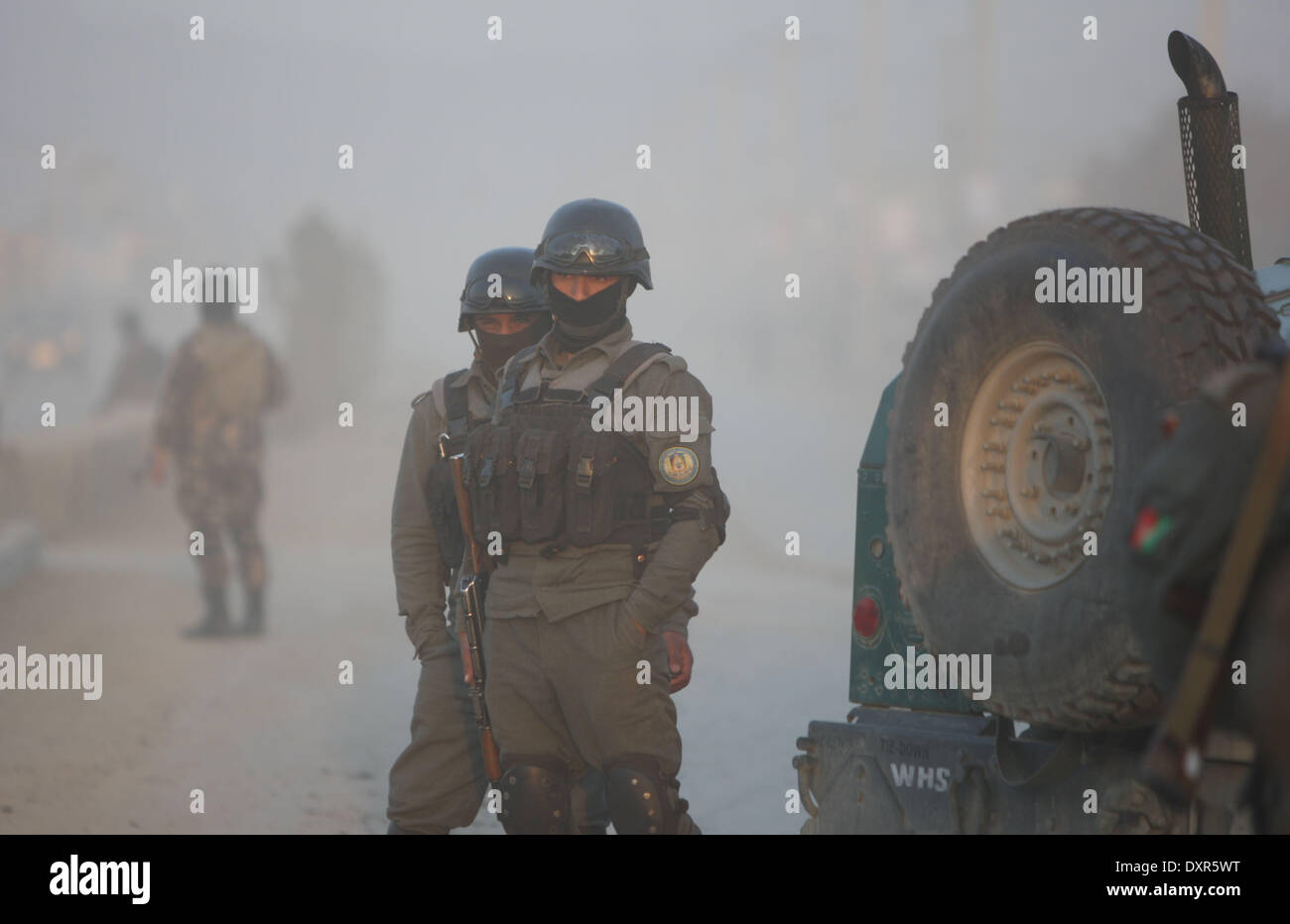 Kabul, Afghanistan. 29th Mar, 2014. Afghan soldiers stand guard at the site of the attack close to the election office in Kabul, Afghanistan on March 29, 2014. A five-hour gun fight close to the Afghanistan's main election office in Kabul ended Saturday evening after Taliban gunmen were killed in the counter-attack, an official said. Credit:  Ahmad Massoud/Xinhua/Alamy Live News Stock Photo