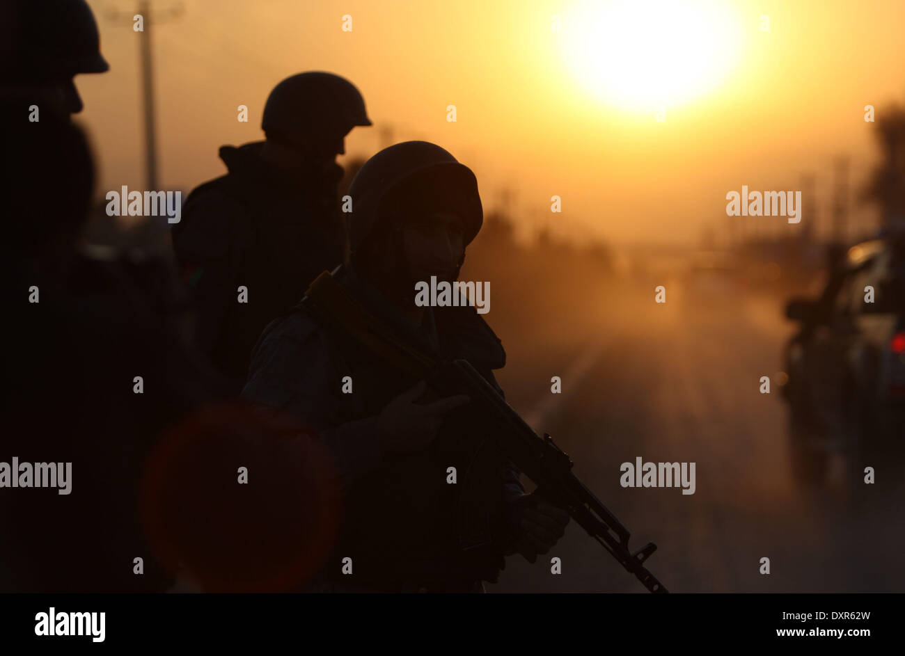 Kabul, Afghanistan. 29th Mar, 2014. Afghan soldiers stand guard at the site of the attack close to the election office in Kabul, Afghanistan on March 29, 2014. A five-hour gun fight close to the Afghanistan's main election office in Kabul ended Saturday evening after Taliban gunmen were killed in the counter-attack, an official said. Credit:  Ahmad Massoud/Xinhua/Alamy Live News Stock Photo