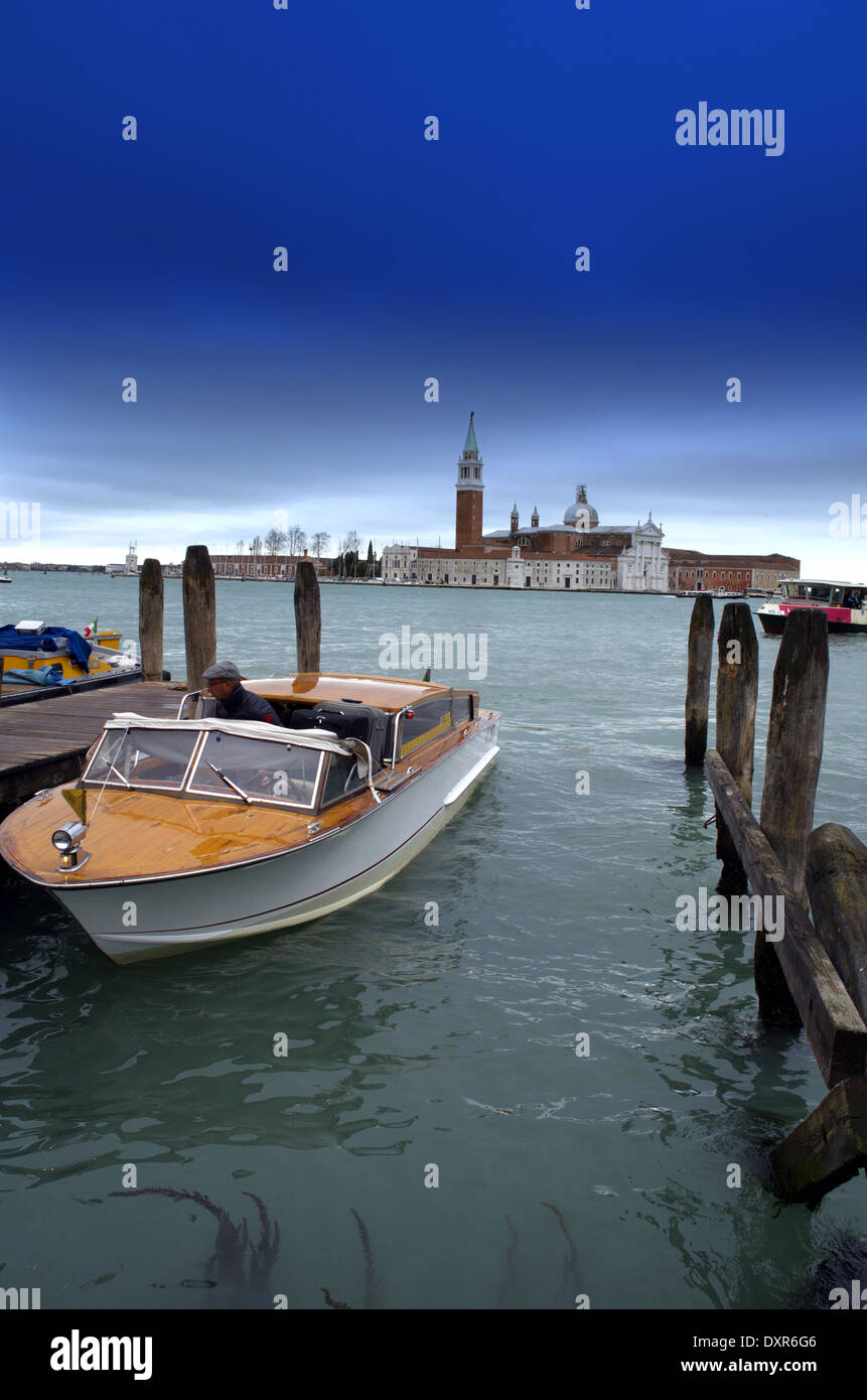 Traditional touristic water taxi boat in Venice in Italy Stock Photo