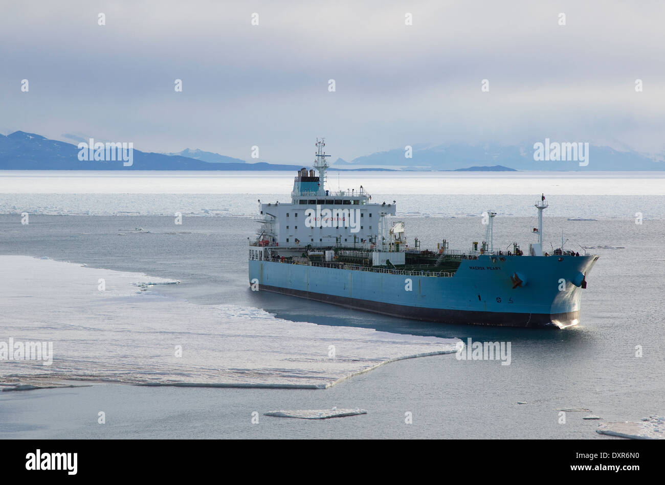 Fuel ship, fuel tanker, in McMurdo Sound, Ross Sea, Antarctica, with Mount Discovery in distance Stock Photo