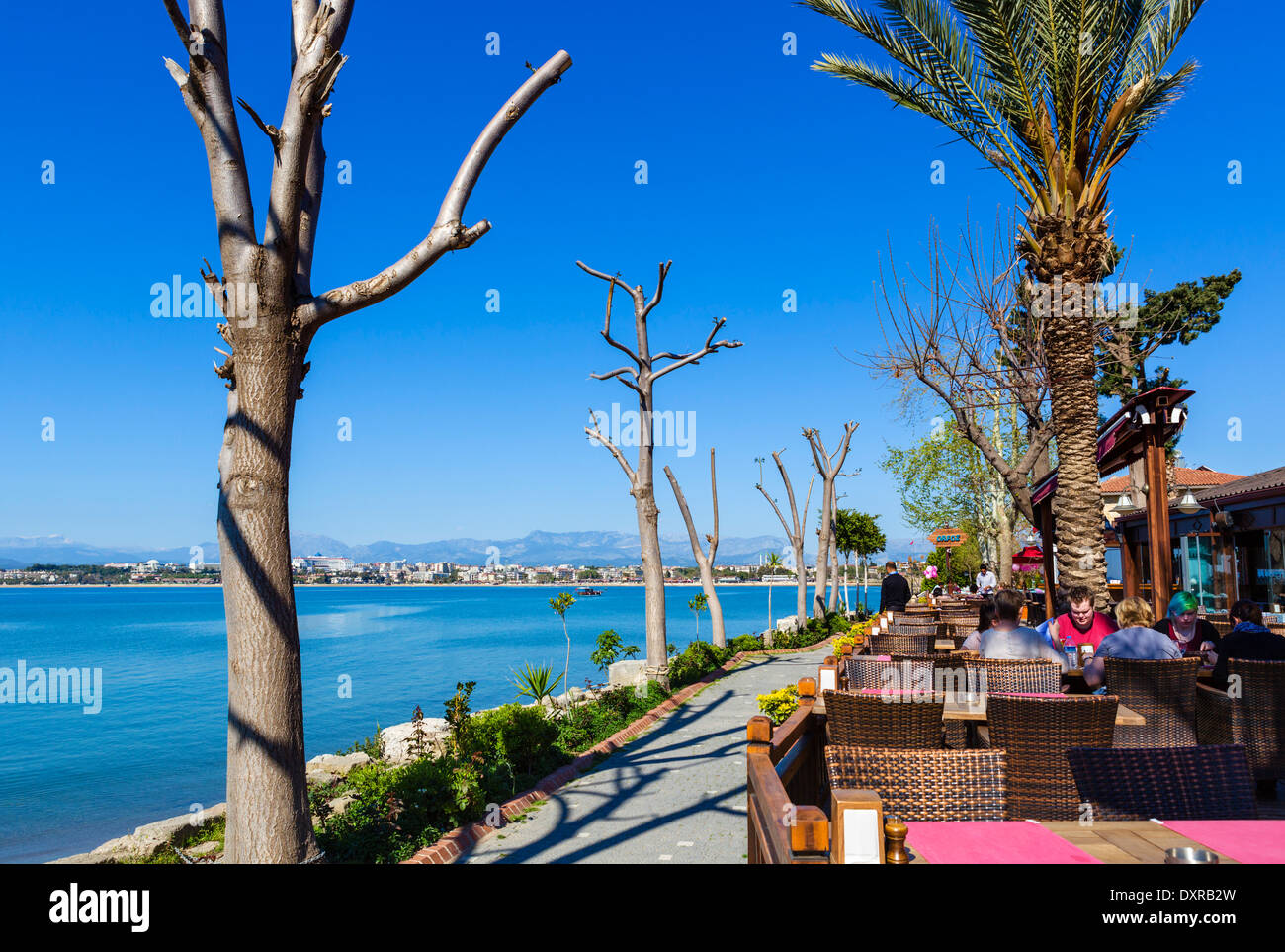 Waterfront restaurant in the old town looking towards beaches and hotel zone to the west, Side, Antalya Province, Turkey Stock Photo