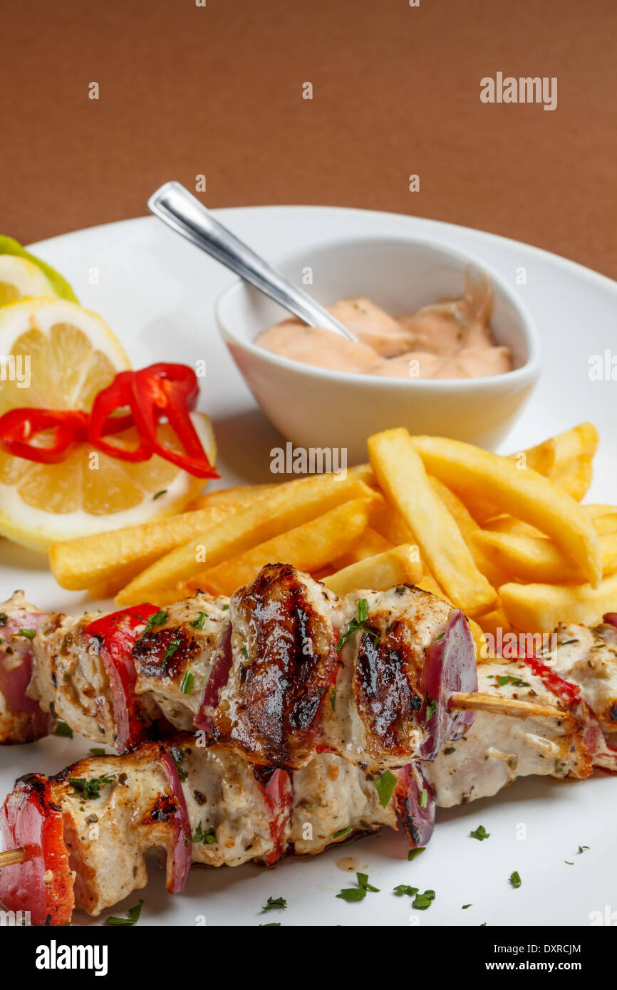 Fresh roast chicken shish kebab on white plate Stock Photo