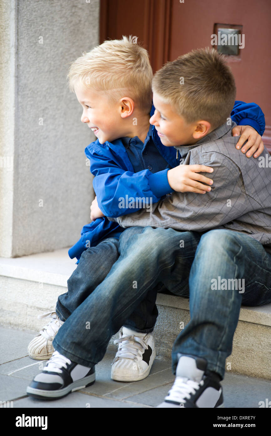 young boys hugging