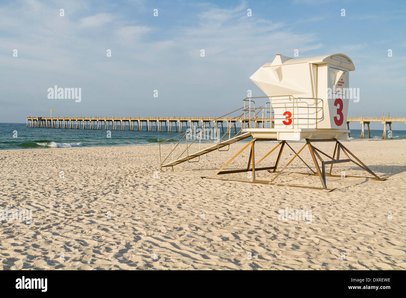 A lifeguard station and the fishing pier in the early morning on