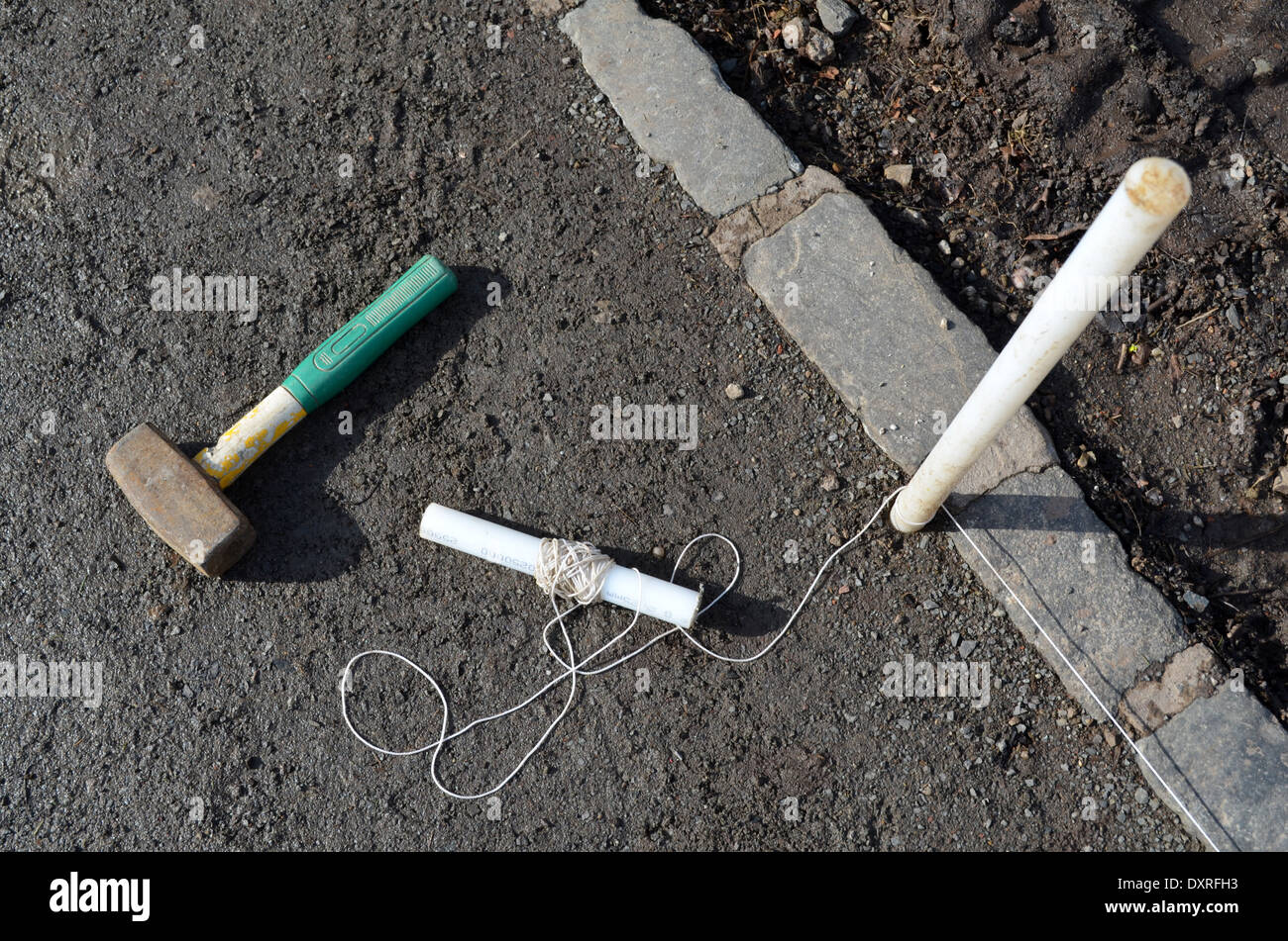 Hammer and string, essential tools for laying out Stock Photo