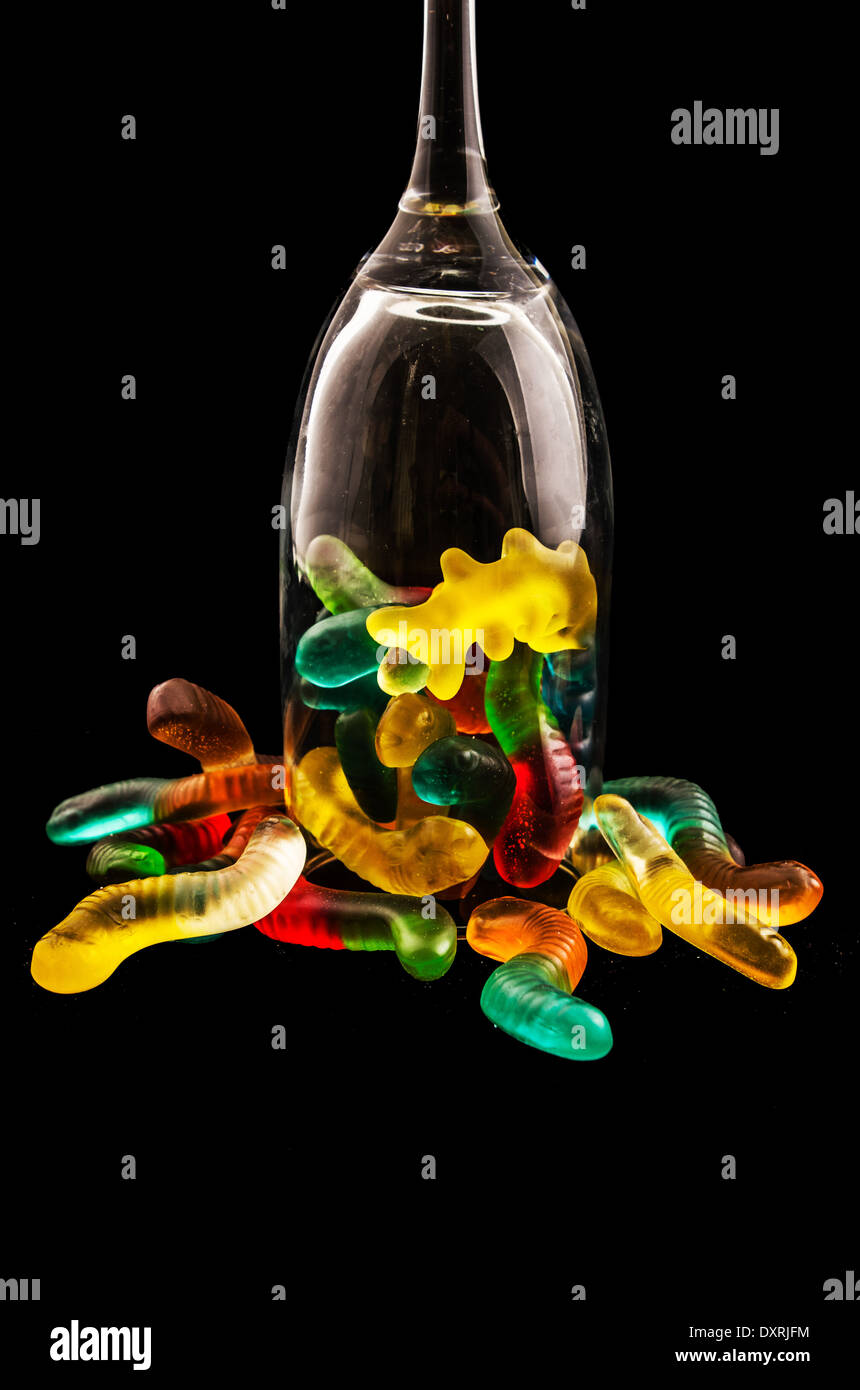 jelly candy and wine glass on a dark background Stock Photo