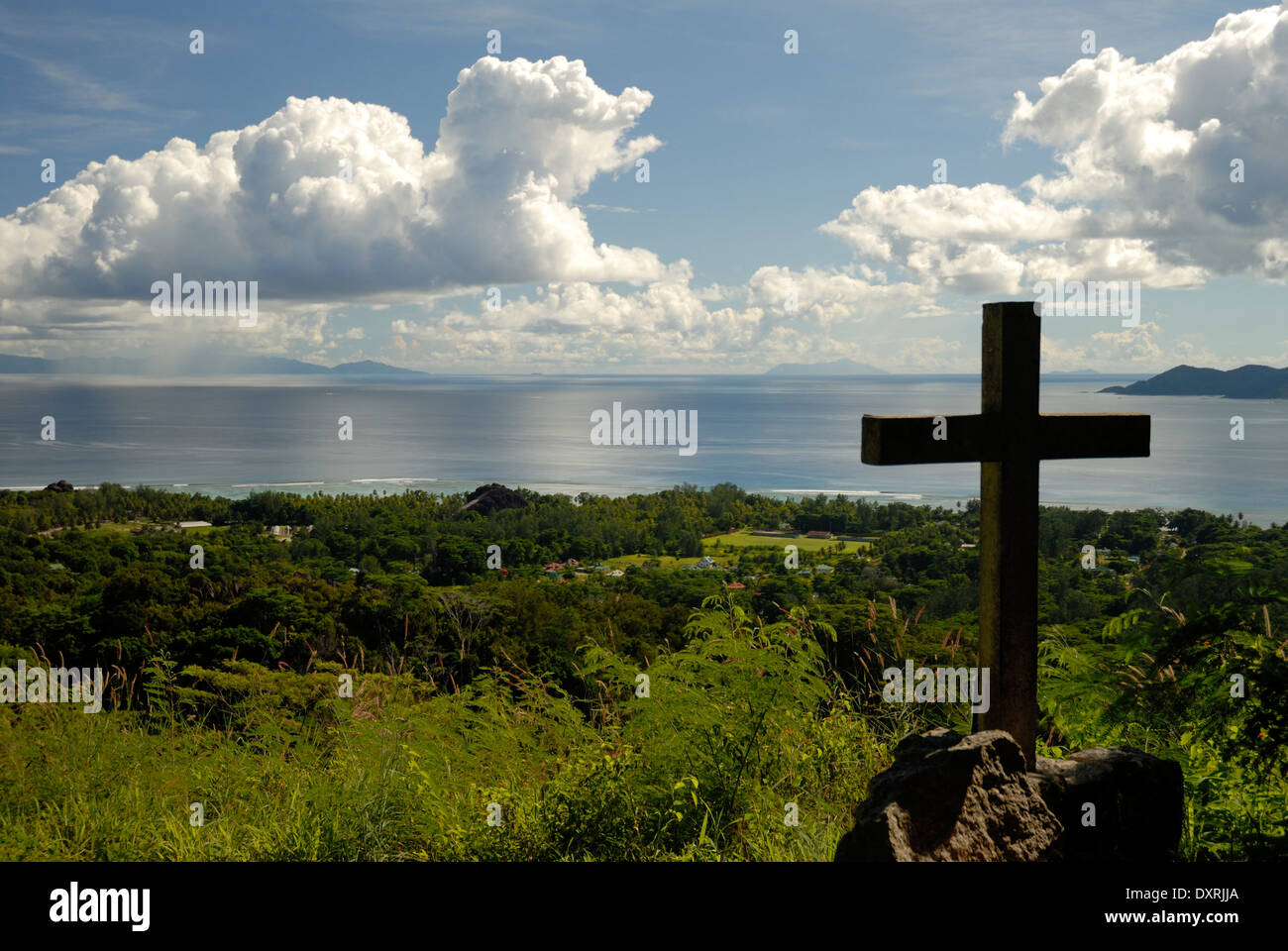 View from Belle Vue with Cross in Foreground and Clouds and Islands in Distance Stock Photo