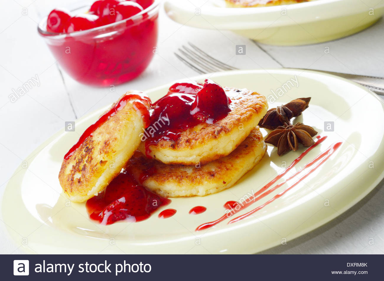 Pan Fried Cottage Cheese Patties With Strawberry Jam Stock Photo