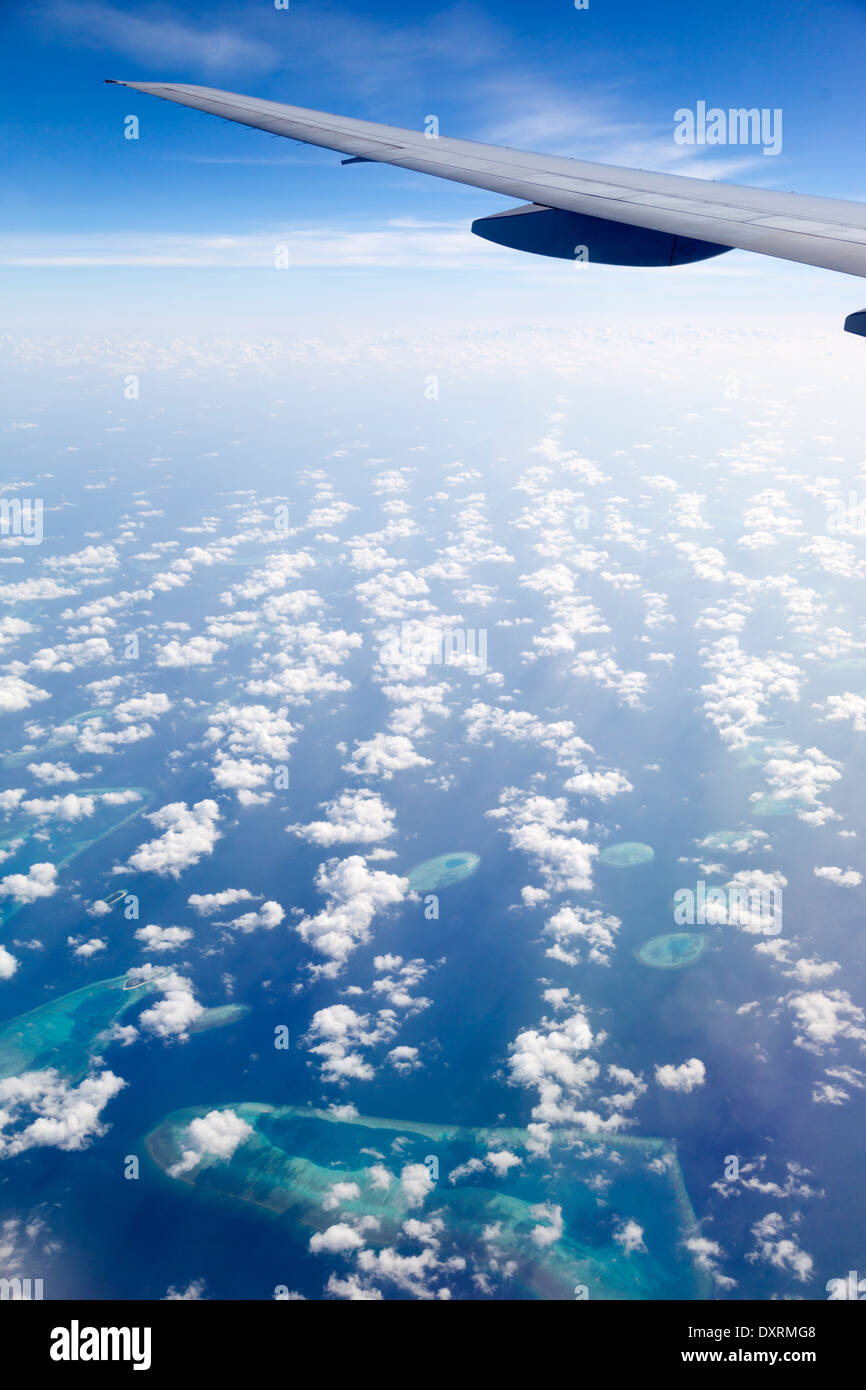 View from the window of an airplane flying above the Maldive Islands in the Indian Ocean 17 Stock Photo